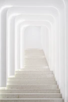 Elegant architectural lighting highlighting a minimalist staircase in a modern home.