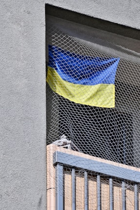 Close-up of a sturdy safety net installed on a balcony.