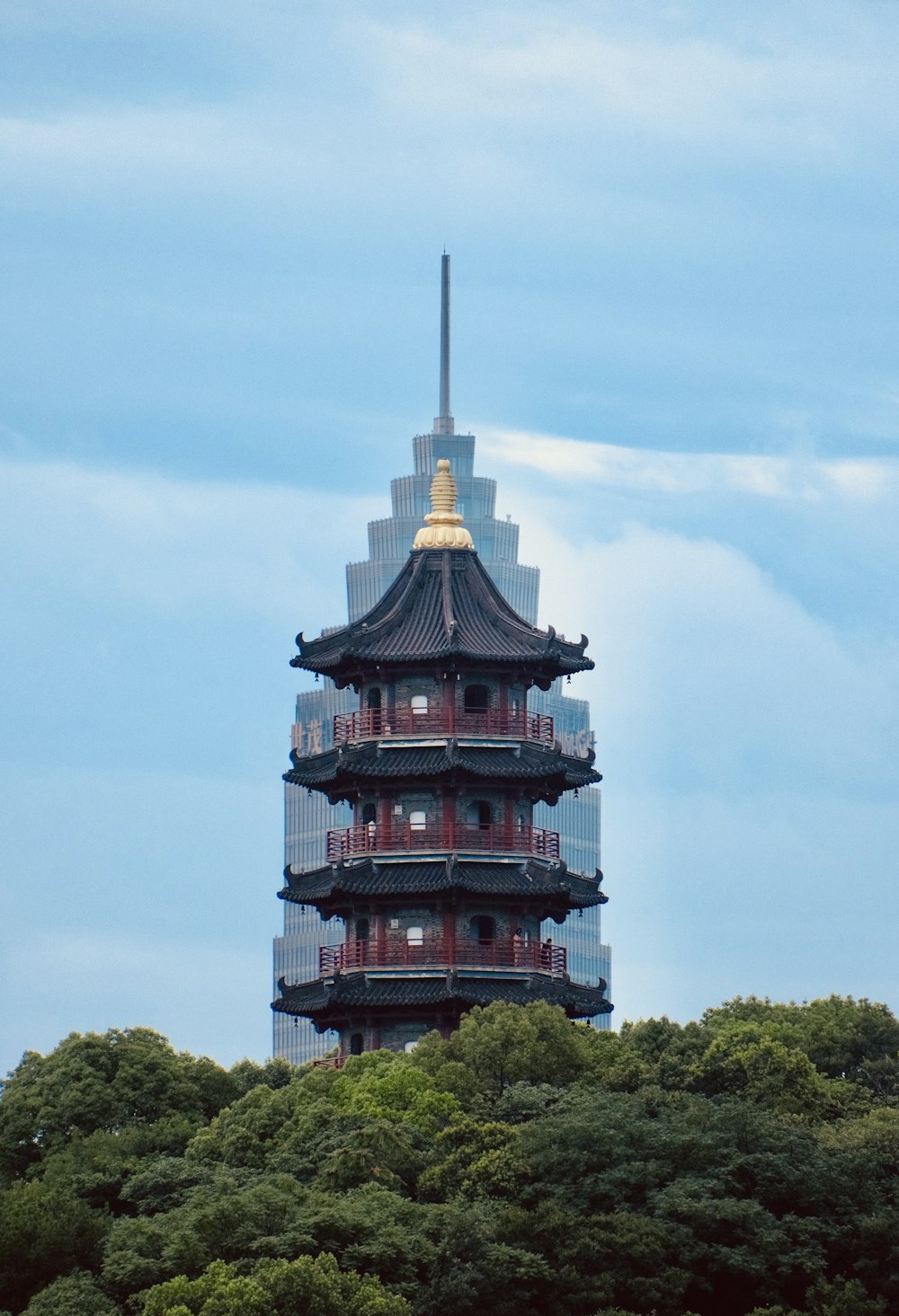 a tall tower with a clock on the top of it