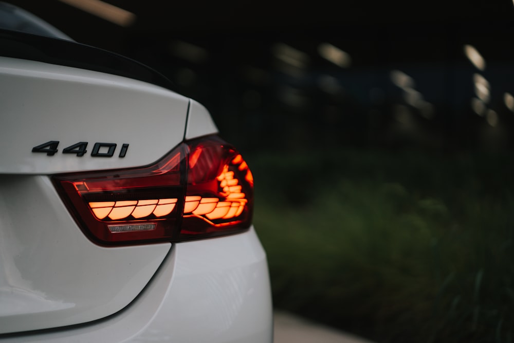 a close up of the tail light of a white car