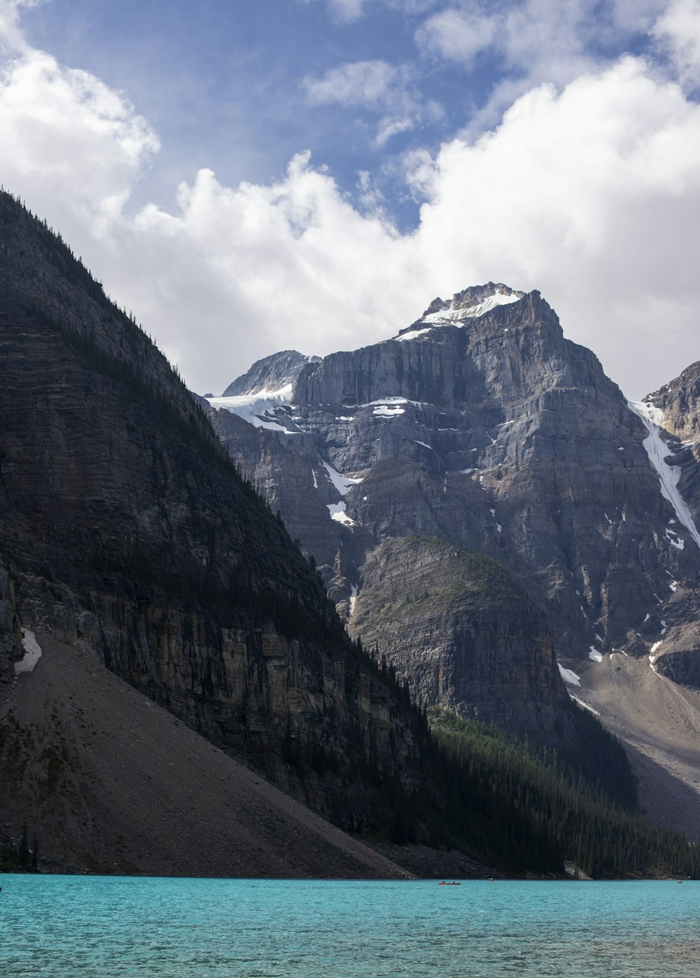 a mountain range with a body of water in front of it