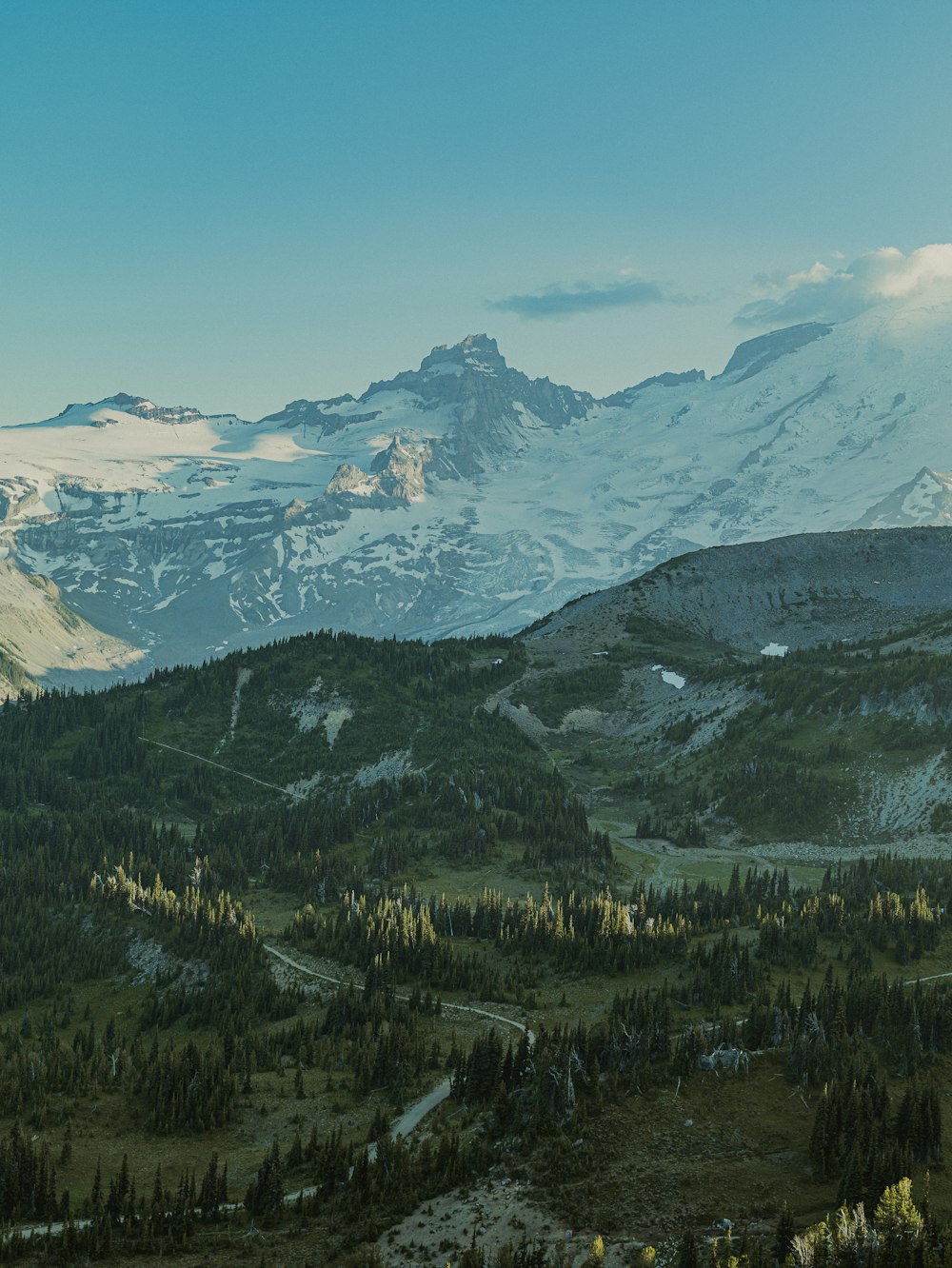 a view of a mountain range with snow on the top