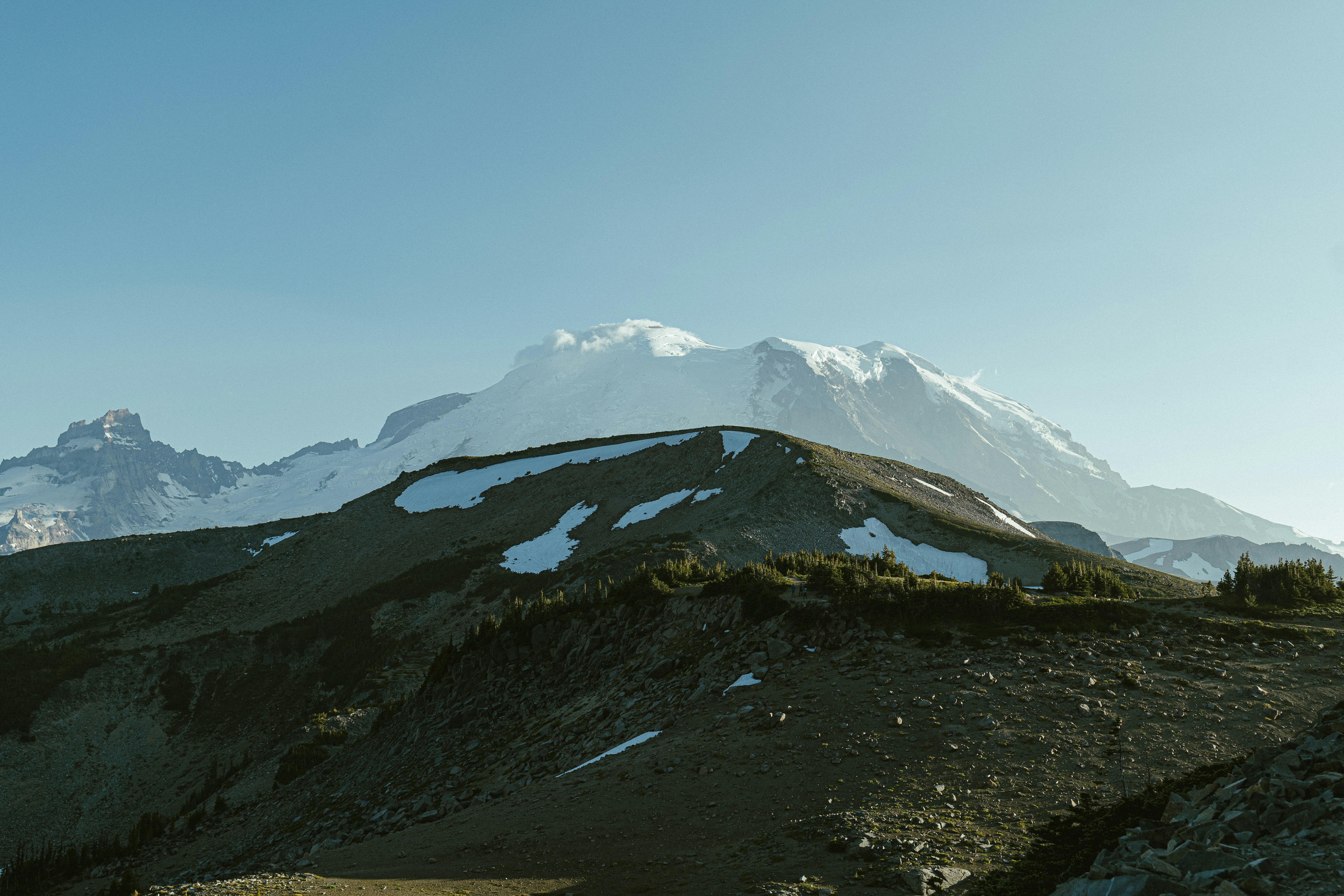 a mountain with a snow covered peak in the distance