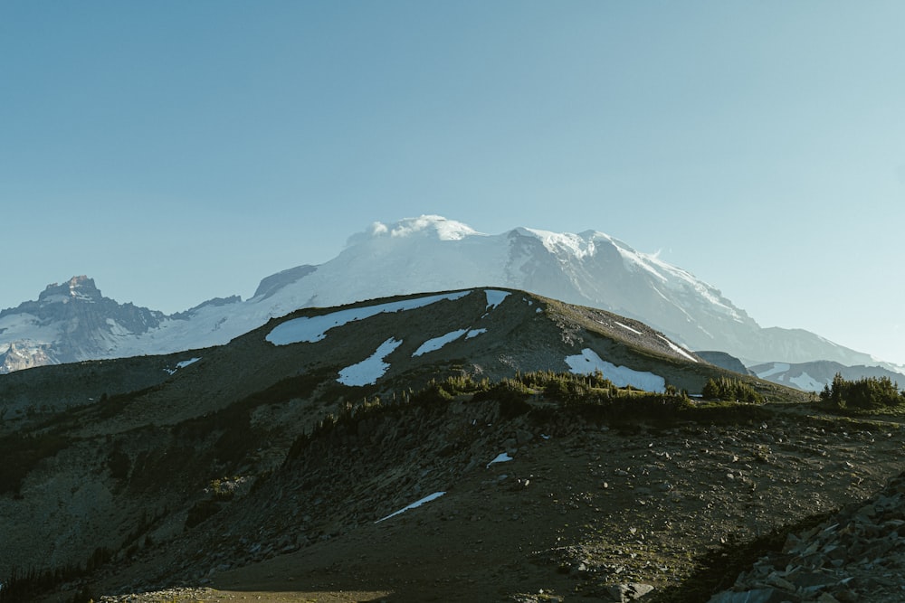 a mountain with a snow covered peak in the distance