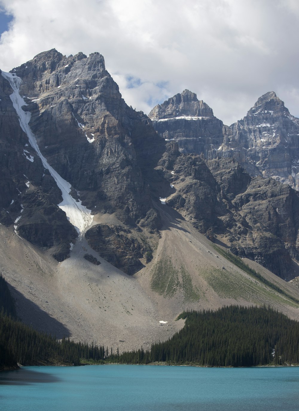 a mountain range with a lake in the foreground