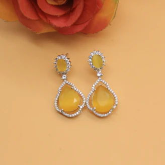 Pair of statement earrings with delicate gold detailing and sparkling stones.