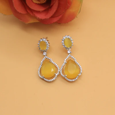 Pair of statement earrings with delicate gold detailing and sparkling stones.