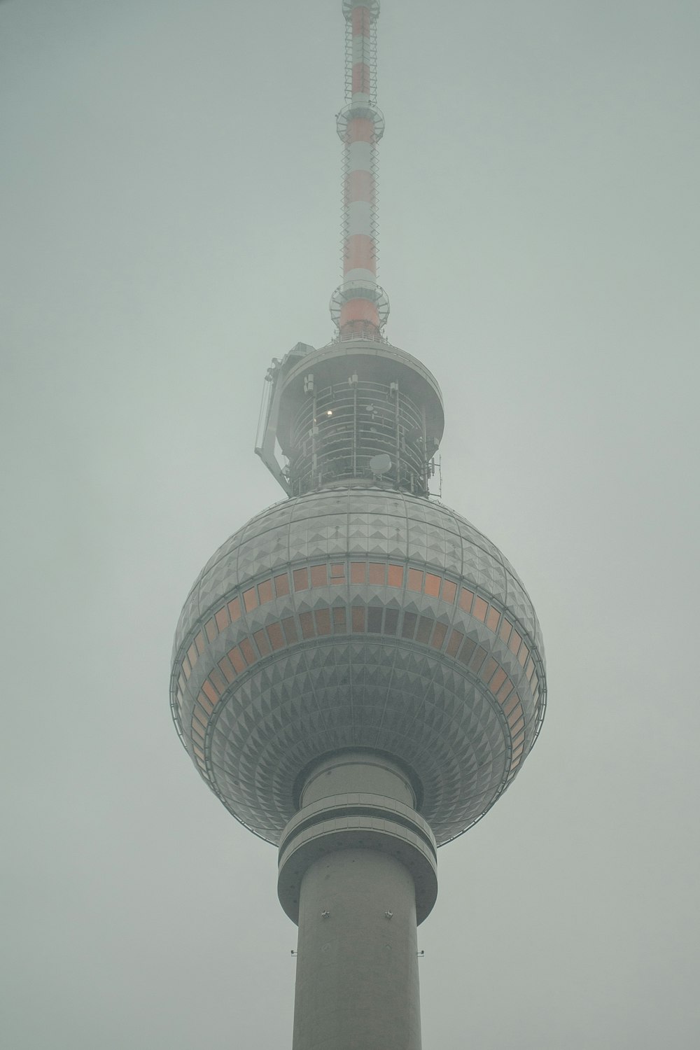 a very tall tower with a clock on it's side