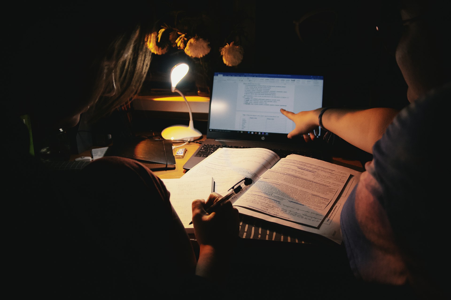 Focused student at desk with laptop