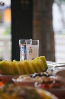 A beautifully arranged table with various meze dishes and rakı.
