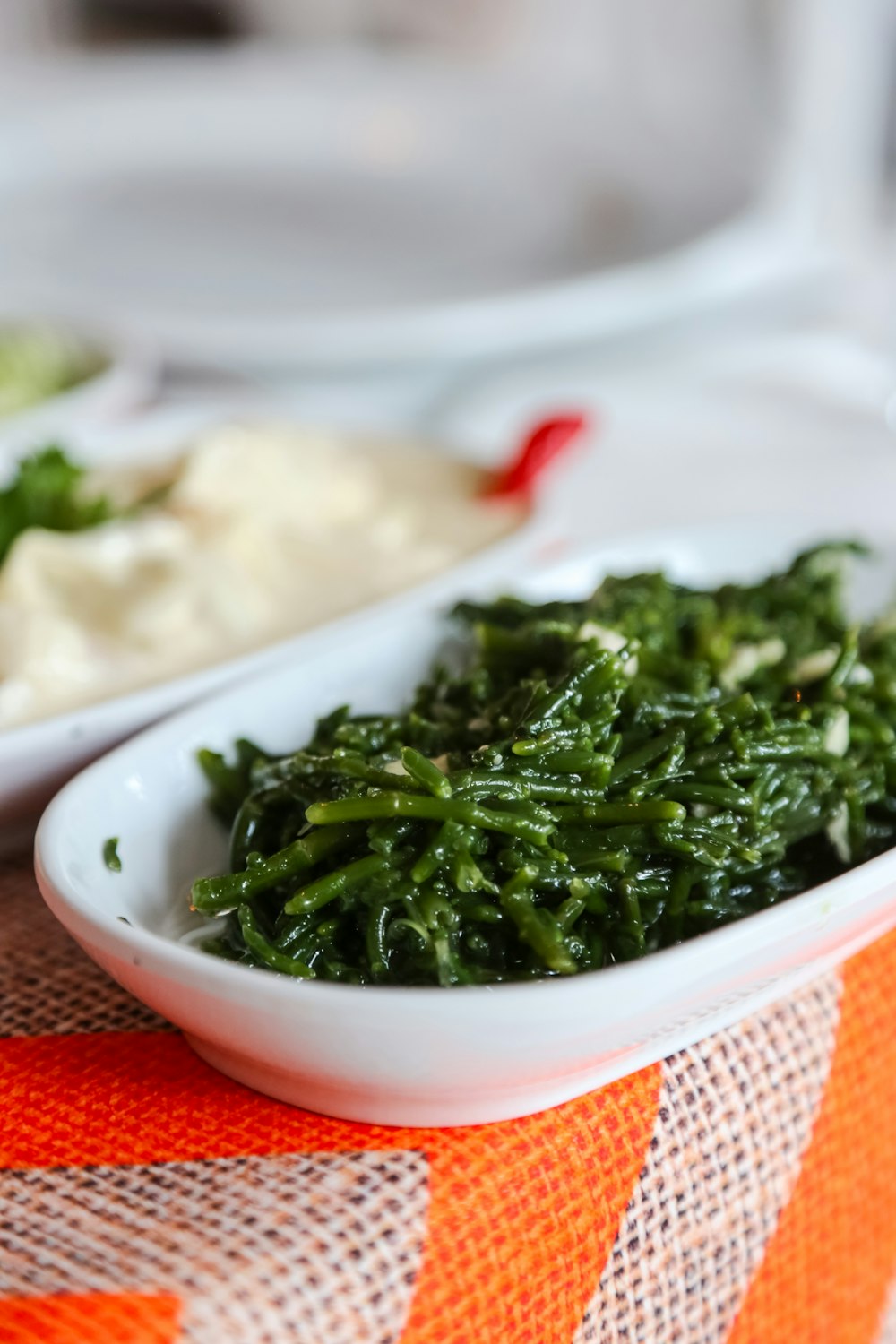 a close up of a bowl of food on a table