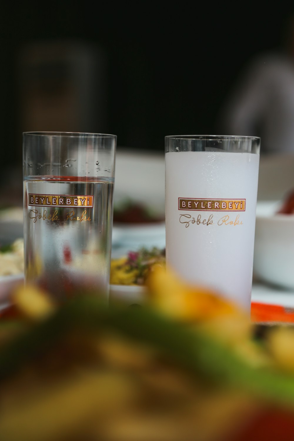 a close up of two glasses on a table