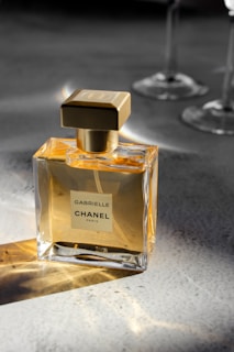 a bottle of perfume sitting on top of a table