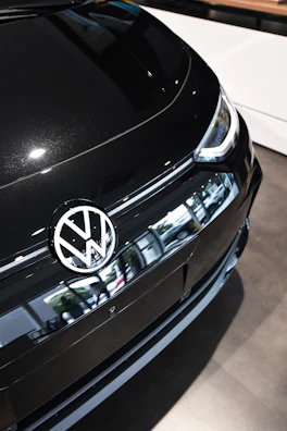 Modern and clean service bay with a Volkswagen car being inspected.