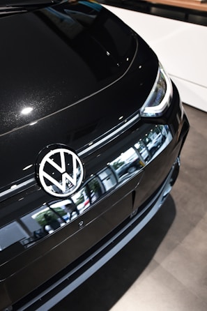 A sleek Volkswagen sedan parked in a bright showroom.