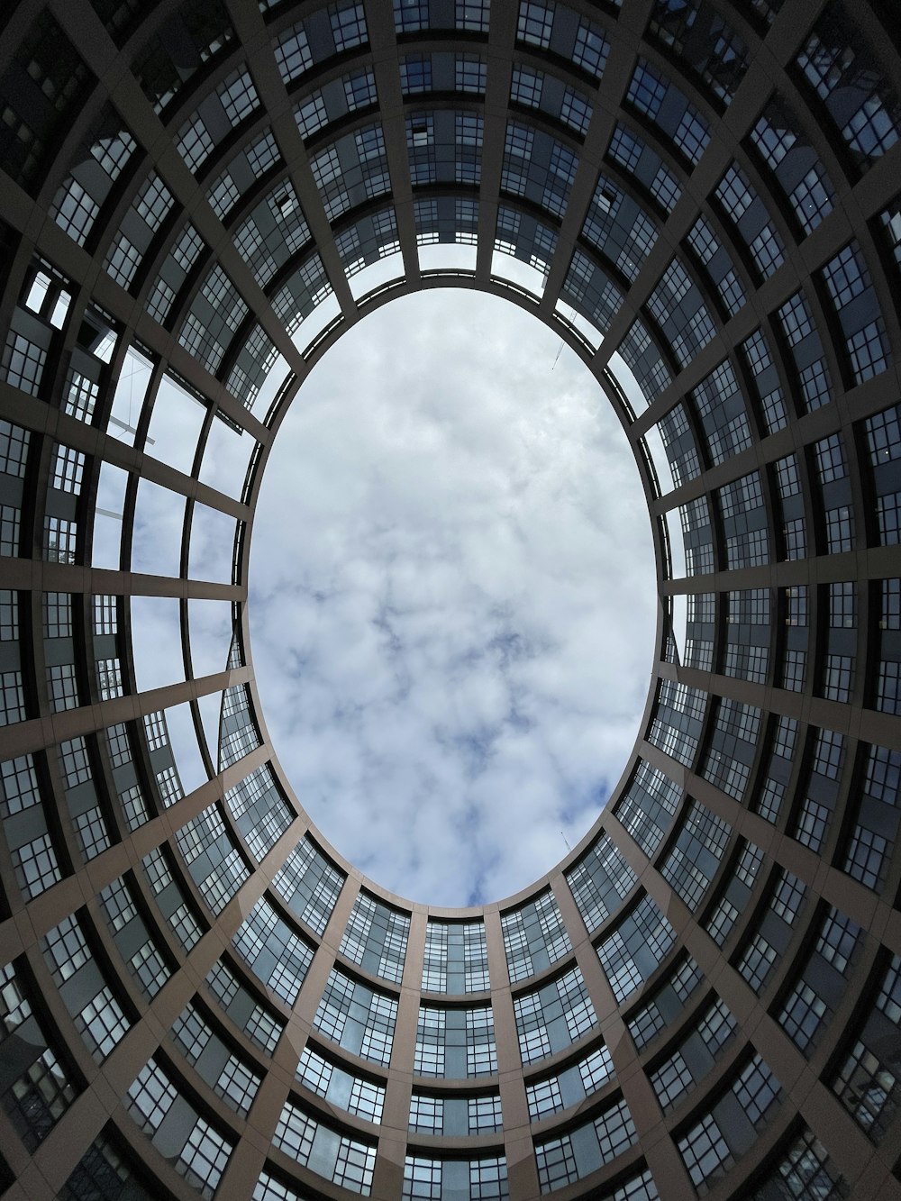 a view of the sky through a circular window