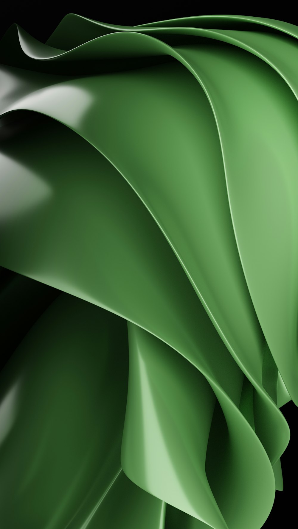 a close up of a green fabric on a black background