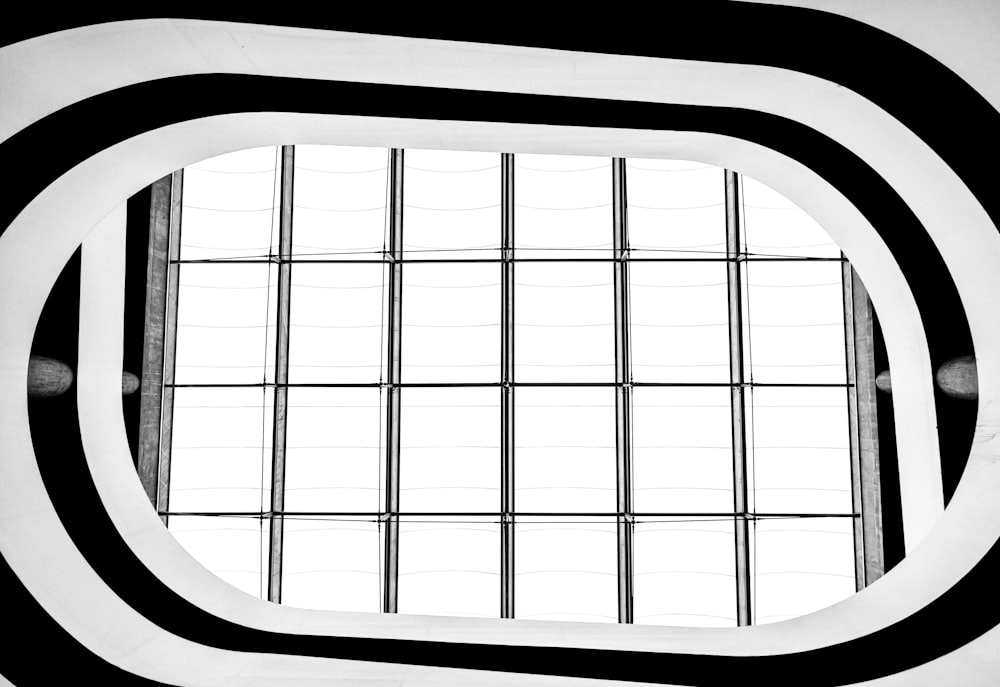 a black and white photo of a window in a building