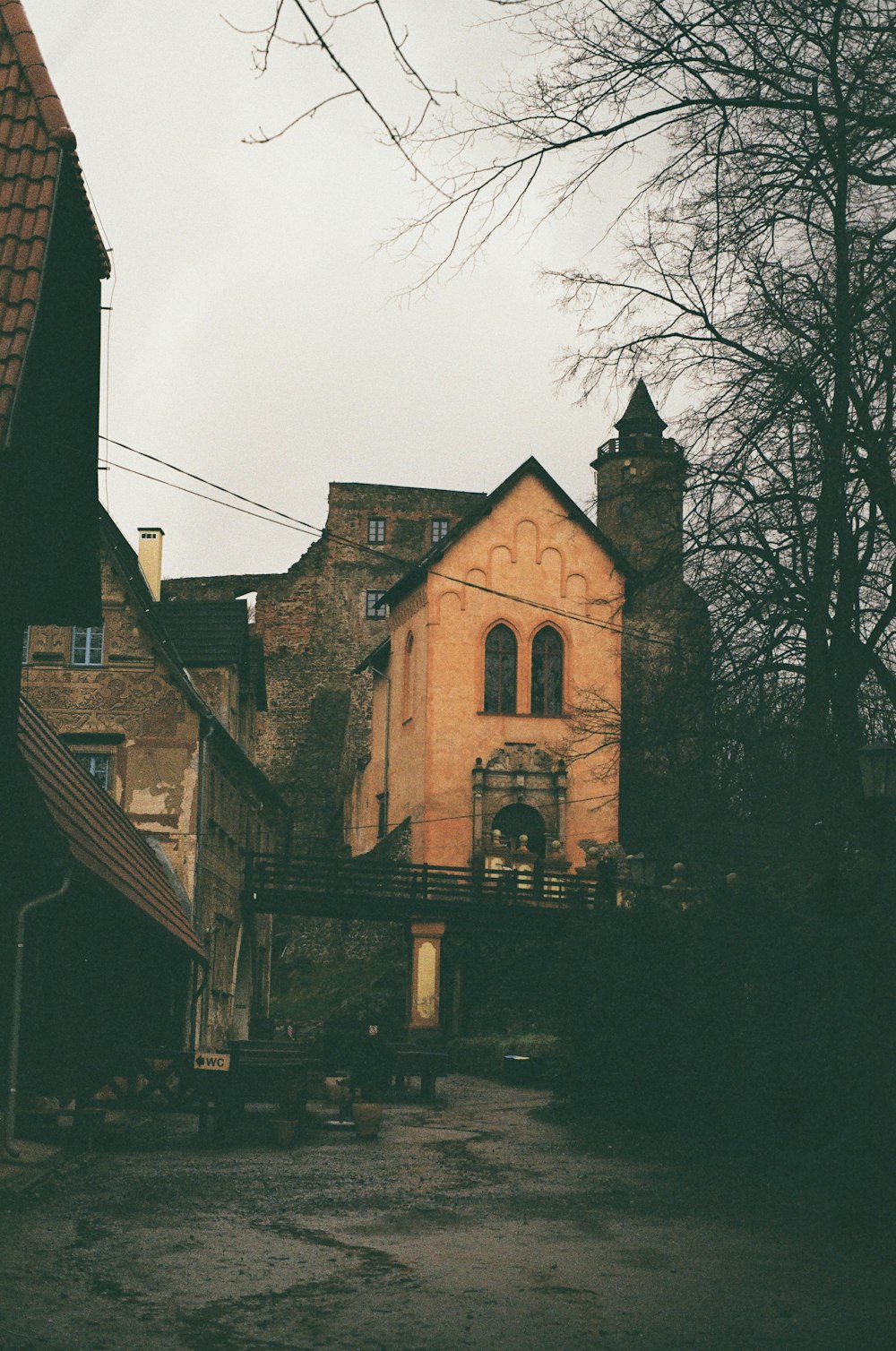 an old building with a clock on the front of it