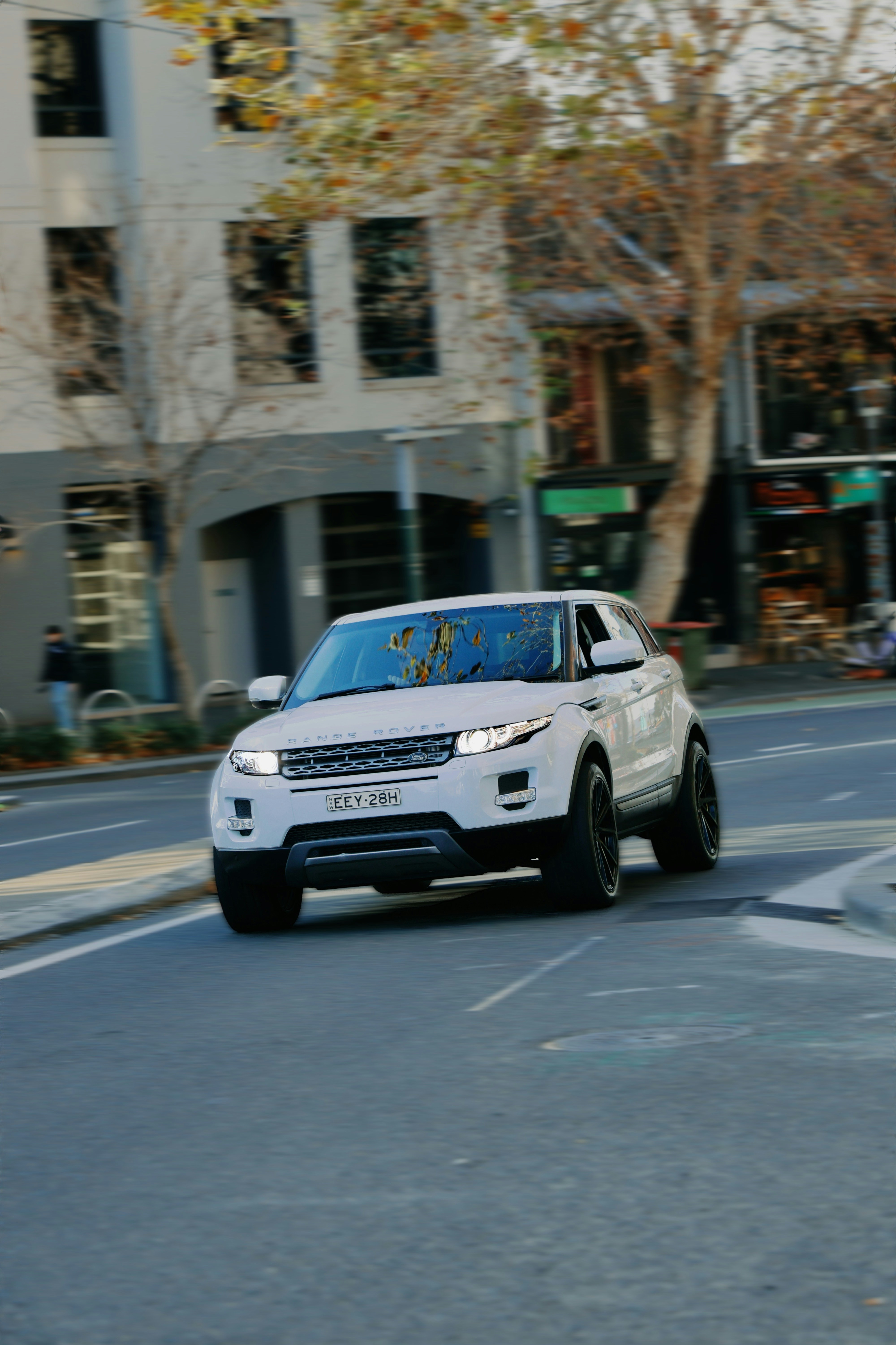 White Range Rover Evoque SUV on urban street
