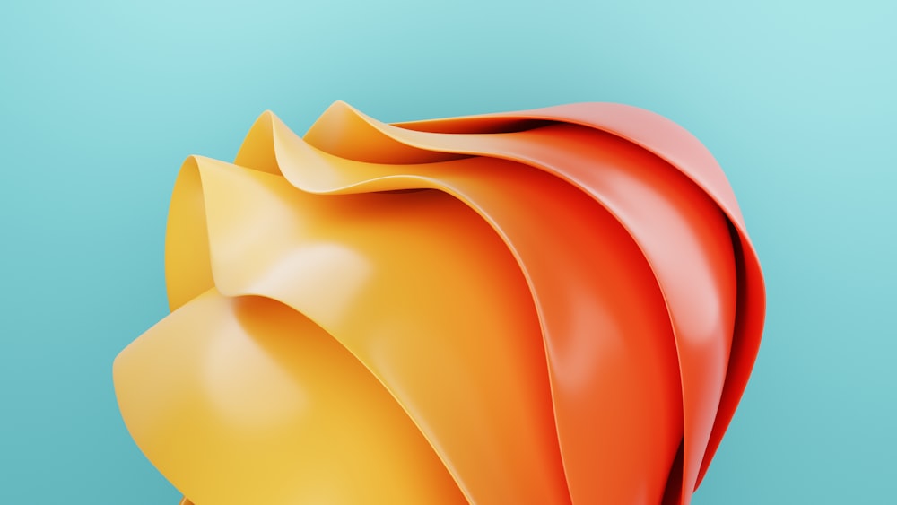 a close up of a red and yellow object on a blue background