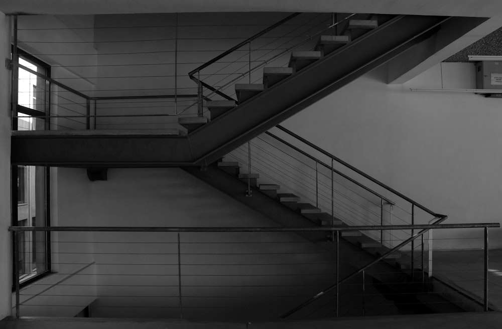 a black and white photo of a stair case