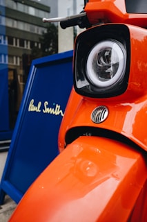 Wide shot of the storefront at 54 Broadwick St, with the Tuya Scooter Store sign visible