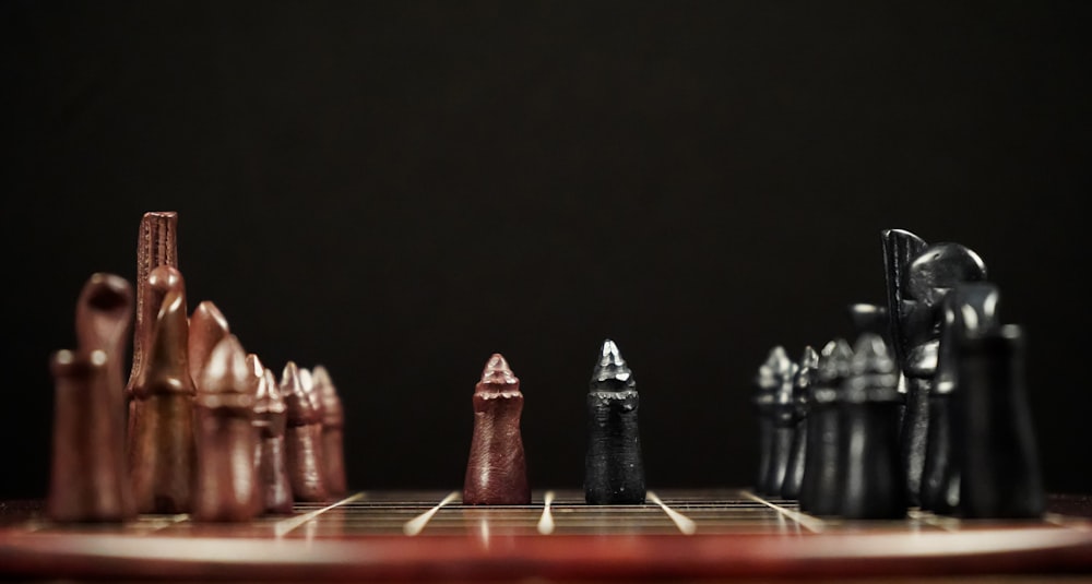 a close up of a chess board with many pieces