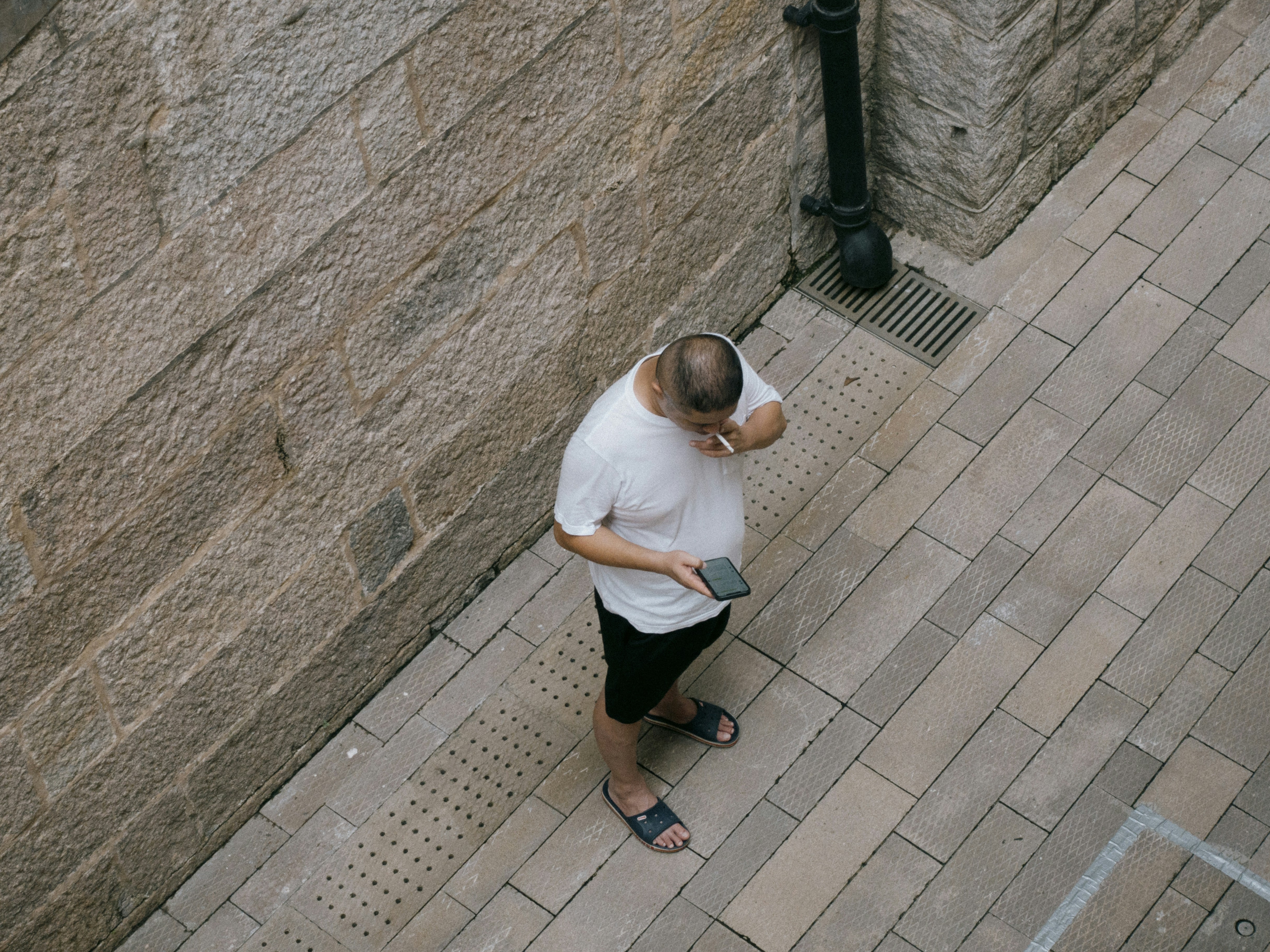 person using voice search on their phone in a city - Future of local SEO