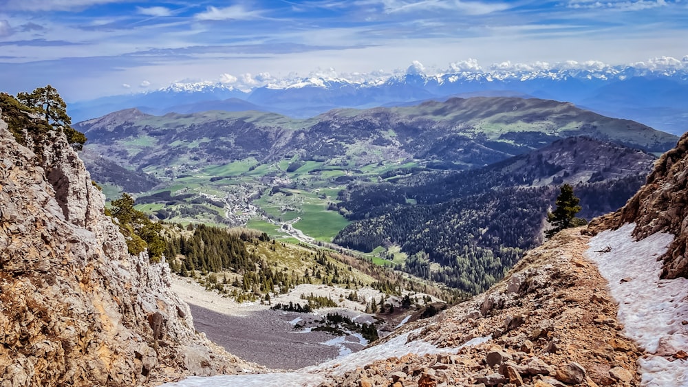 a view of a mountain range from the top of a mountain