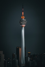 a tall tower with a sky scraper on top of it