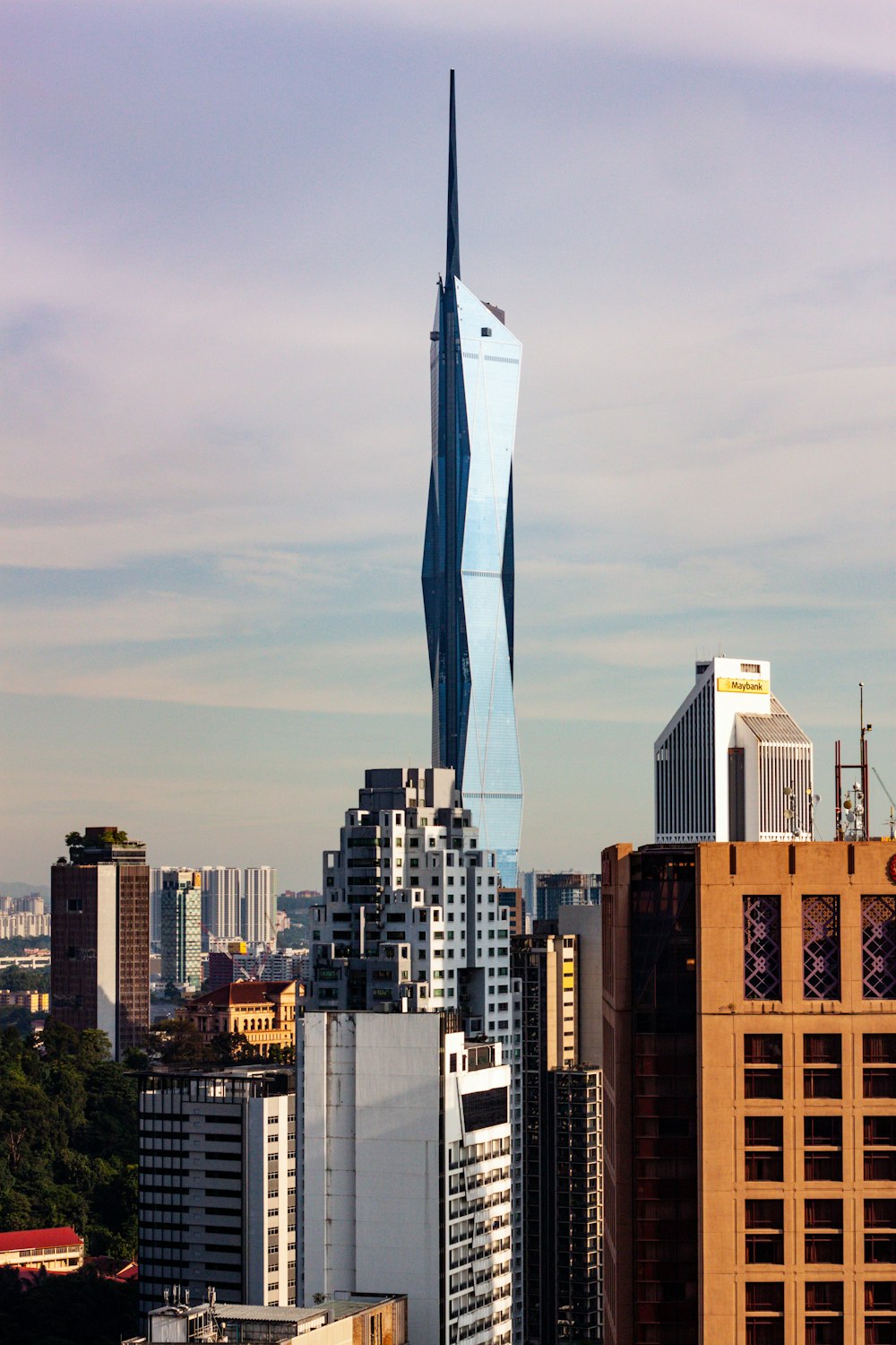 a very tall building towering over a city