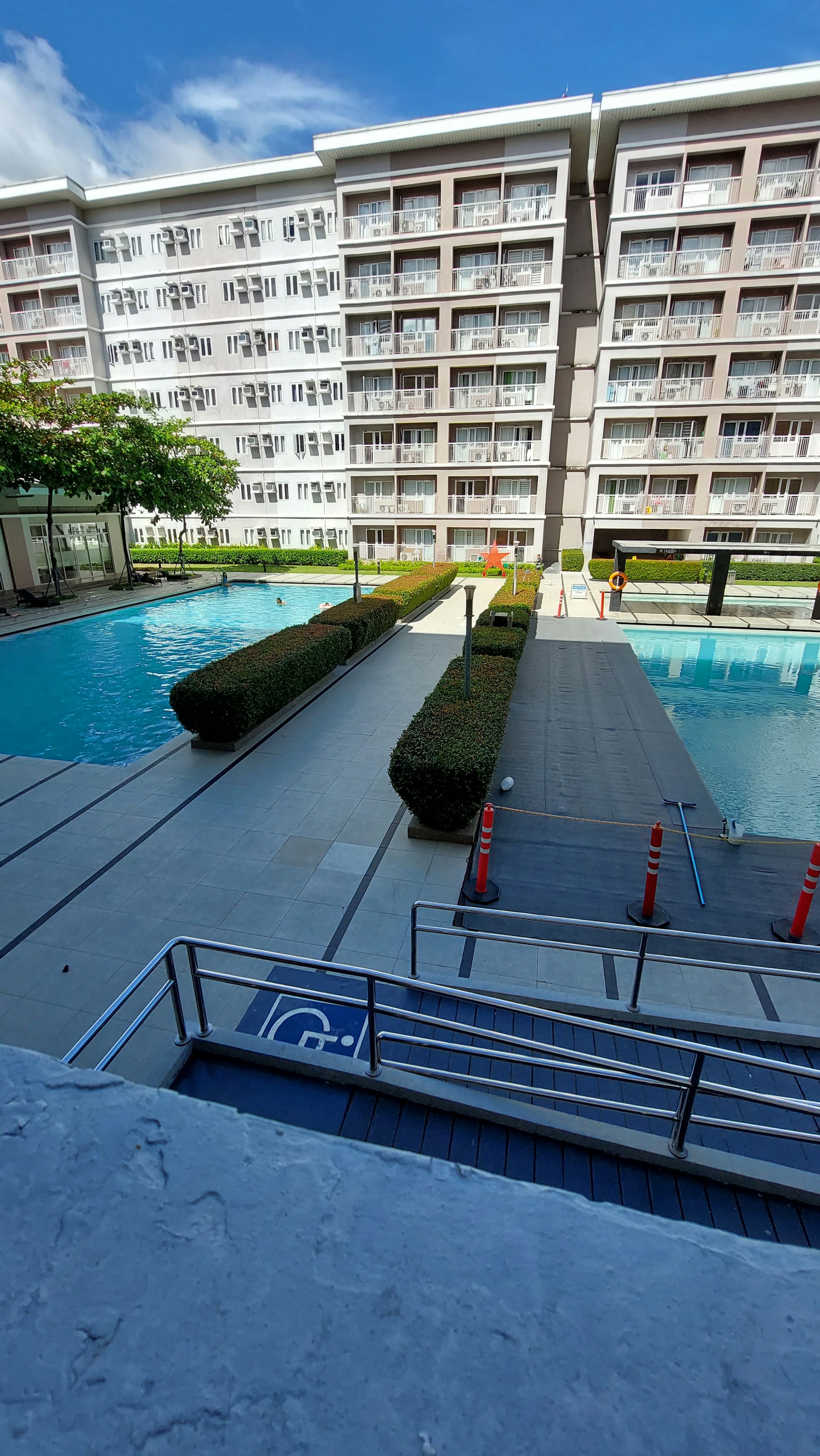 woman wearing yellow long-sleeved dress under white clouds and blue sky during daytime