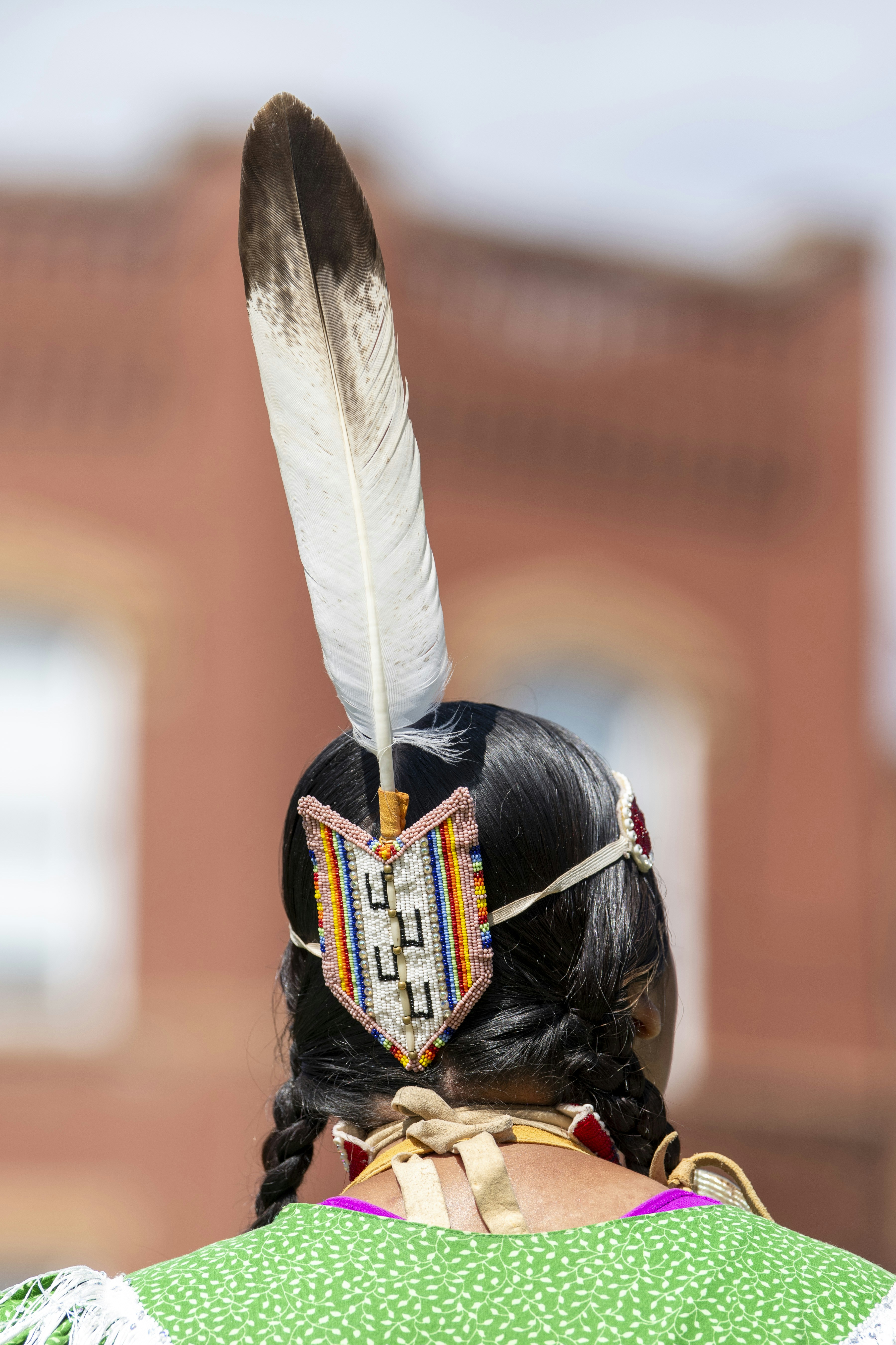 a woman with a feather on her head