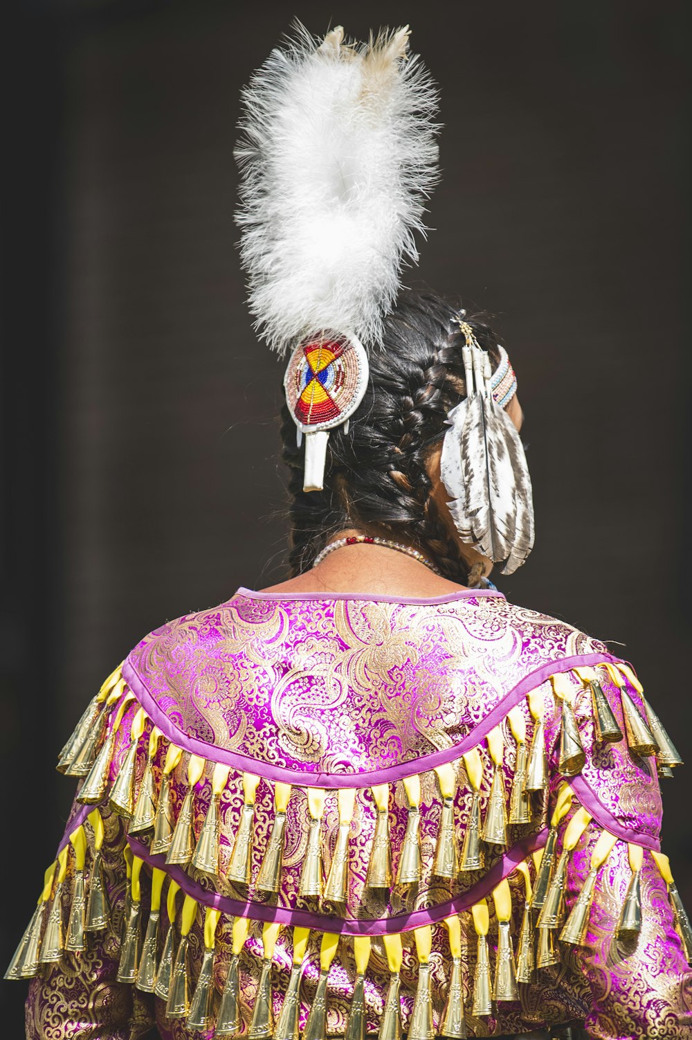 a woman in a costume with feathers on her head