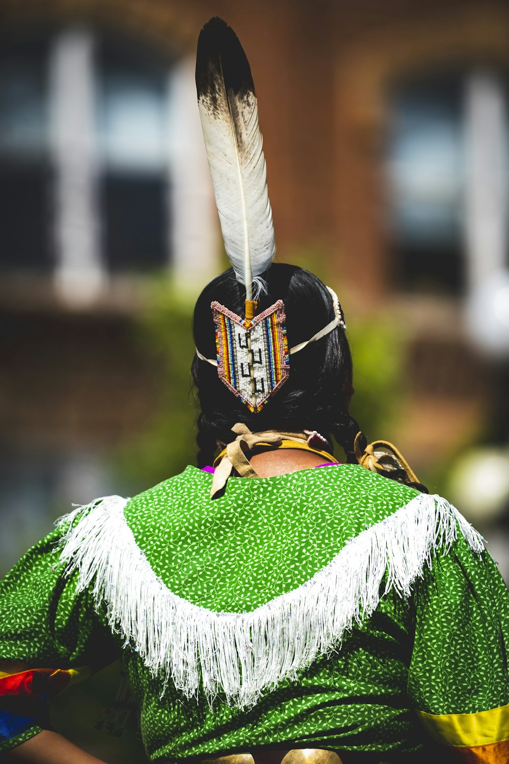 a person with a feather on their head