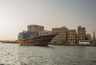 Traditional dhow boats sailing along the Red Sea coast near Jeddah under a clear blue sky.