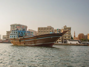 a large boat floating on top of a body of water