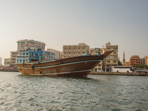 a large boat floating on top of a body of water
