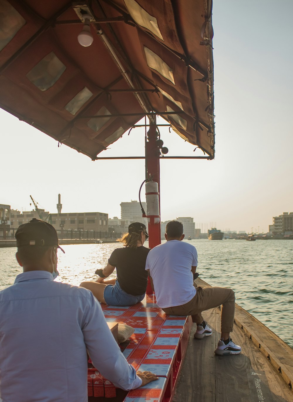 a group of people sitting on top of a boat