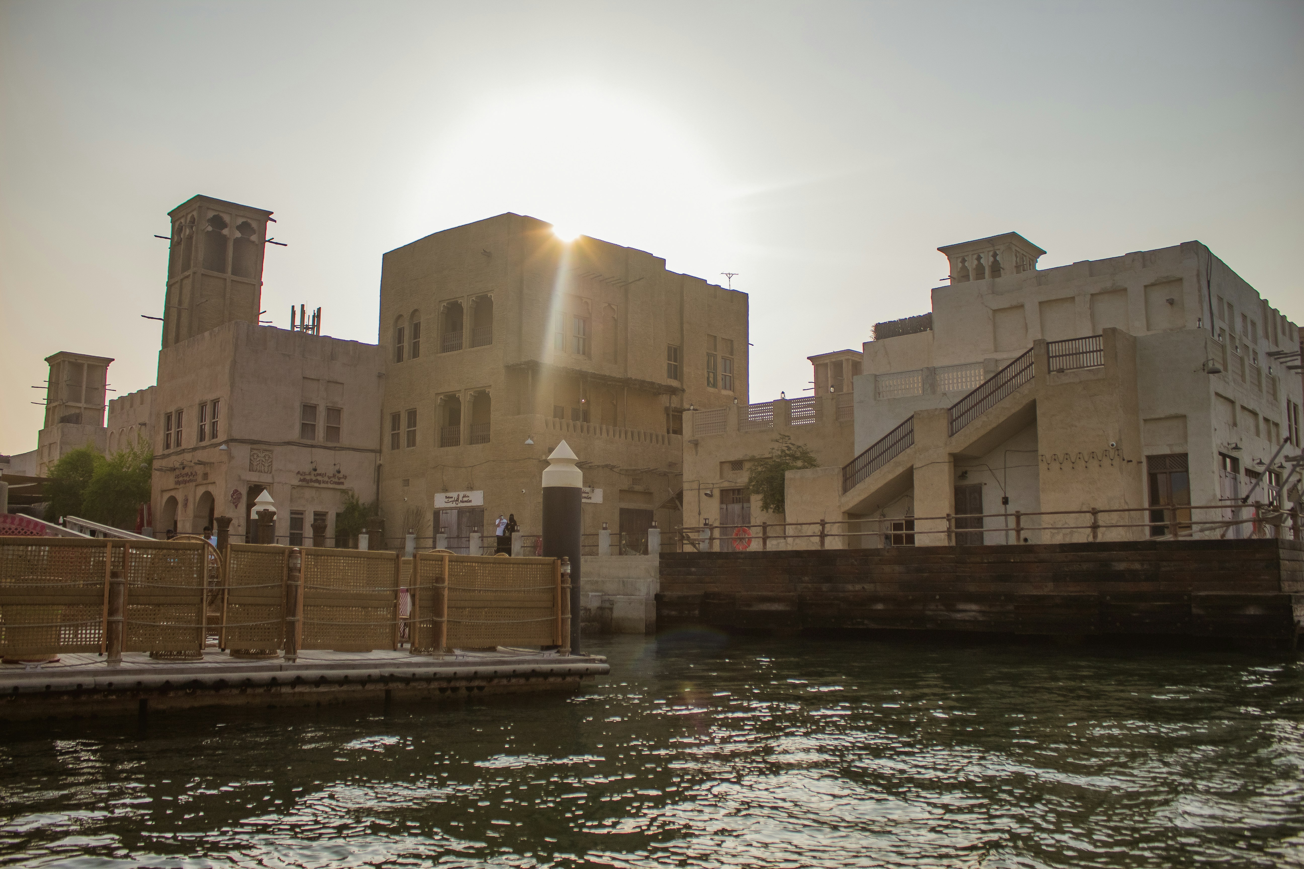 a body of water with buildings in the background