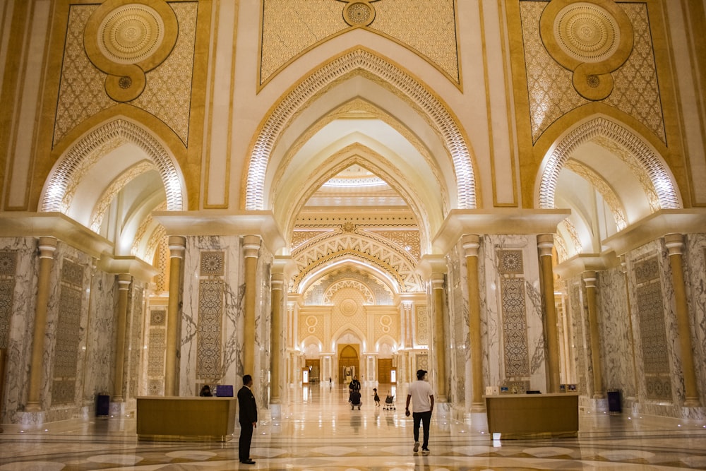 a couple of people that are standing in a building