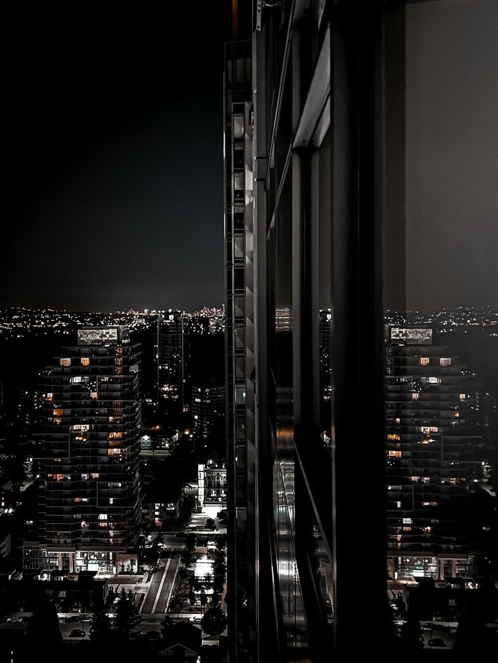 a view of a city at night from a tall building