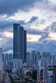 a very tall building towering over a city