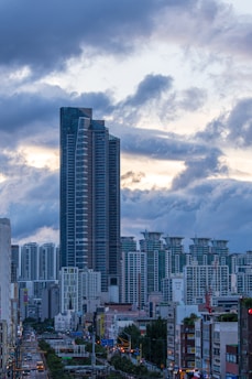 a very tall building towering over a city