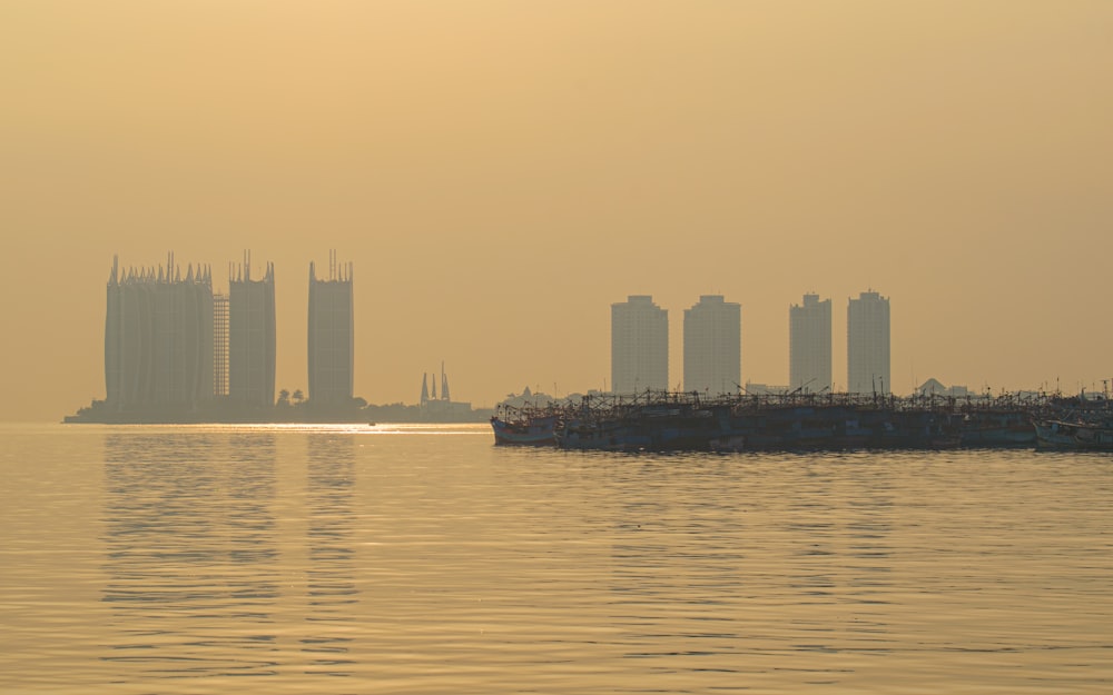 a large body of water with a city in the background