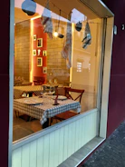 A cozy Scandinavian-style restaurant table set with rustic dishes and warm lighting.