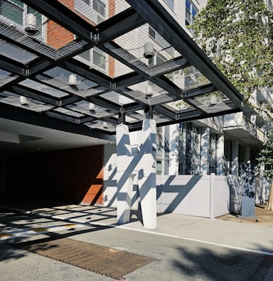 A corporate building entrance enhanced by a modern membrane canopy design.