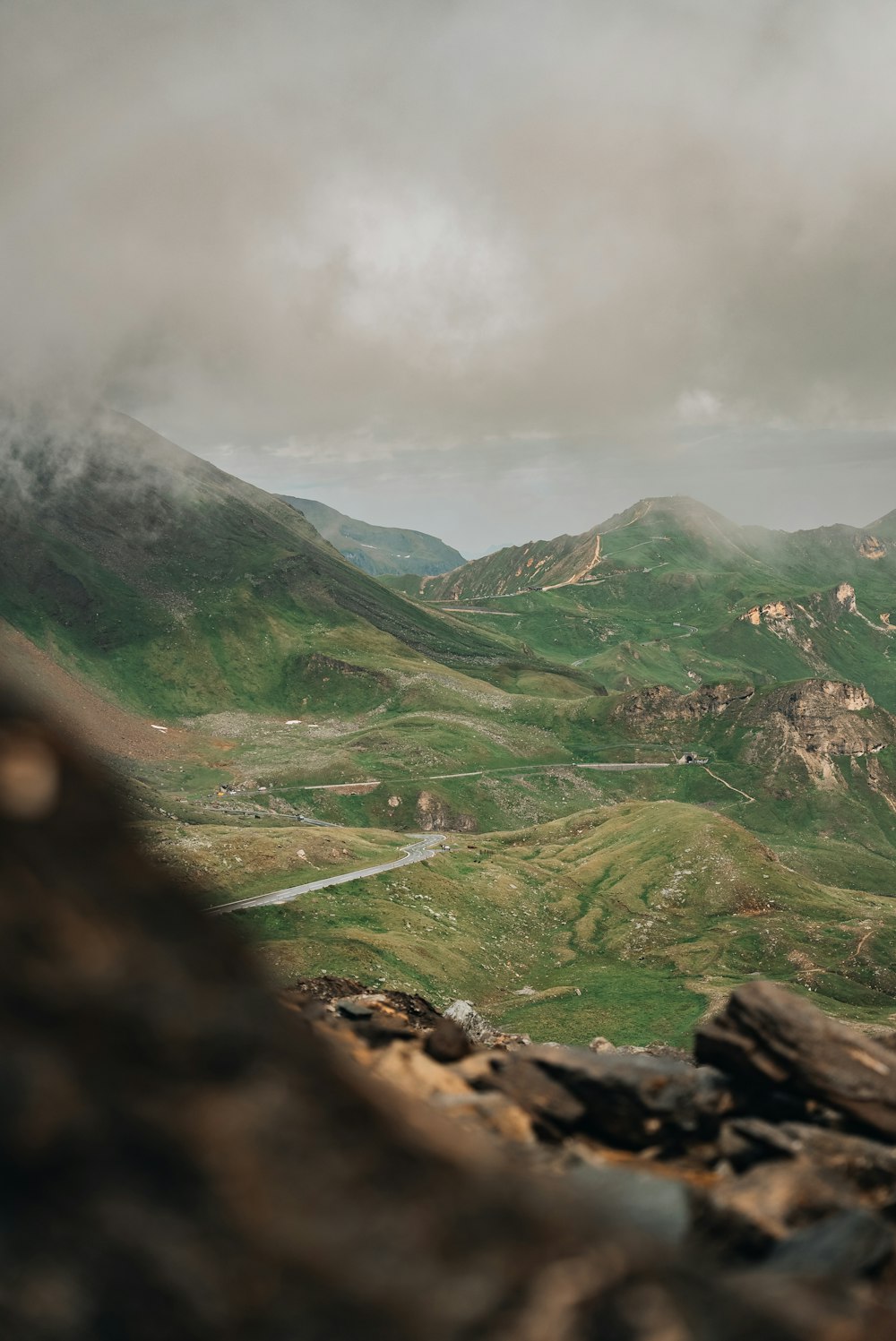 a view of a valley with mountains in the background