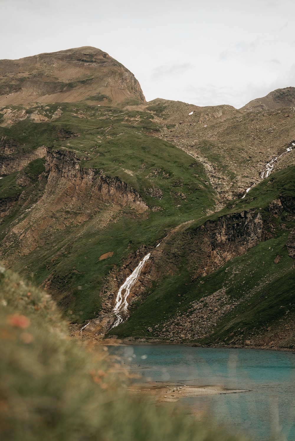 a mountain with a body of water in the middle of it